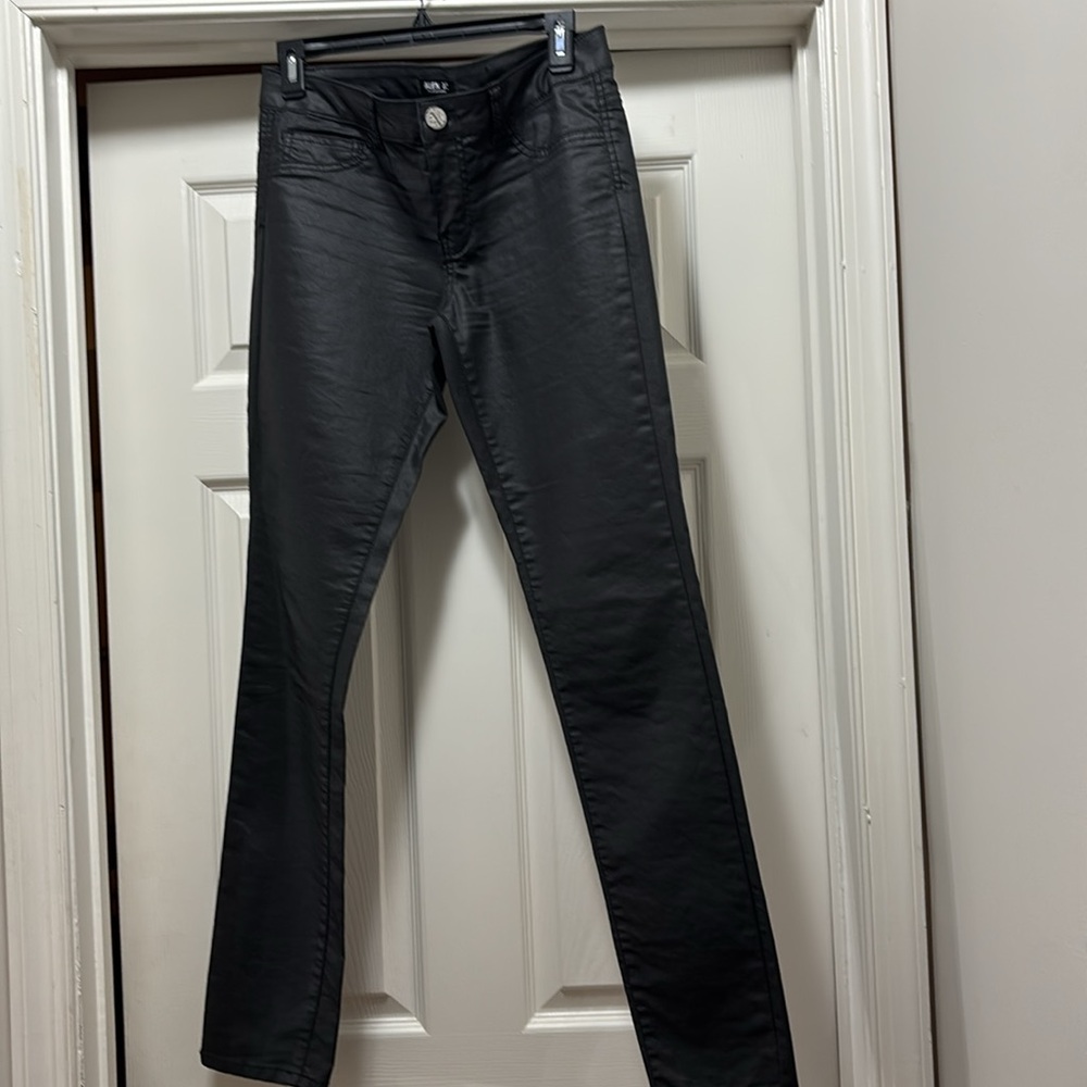 Straight leg satin faux leather finish on jeans makes it unique.